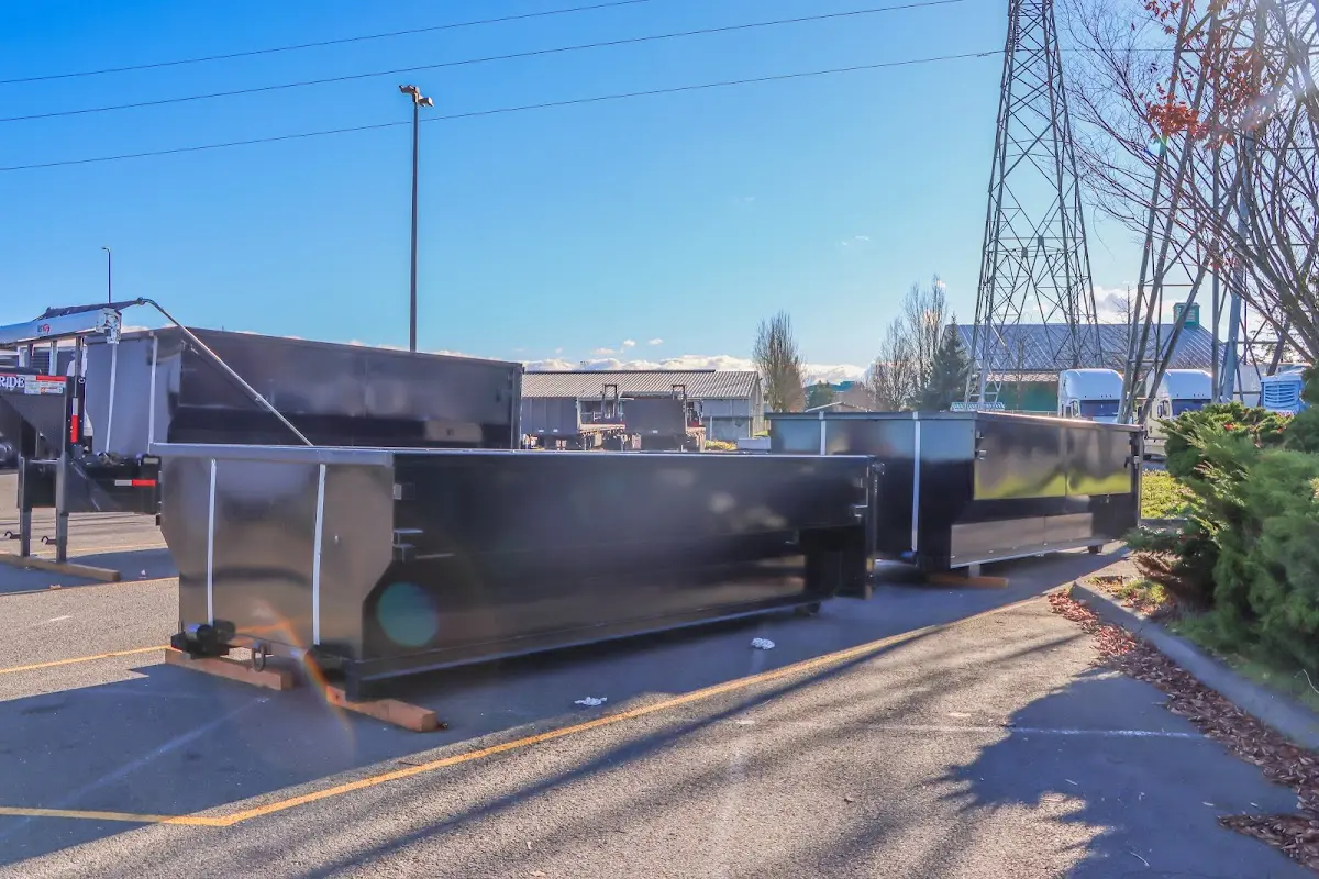 Roll-off dumpster ready for waste disposal at job site for Yard Waste Dumpster Rental in Southold